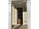 Inviting front entrance with a wood door and white columns, creating a welcoming atmosphere at 155 Cantona Dr, Summerville, SC 29483