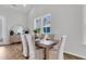 Bright dining area features hardwood floors, neutral decor, a stylish mirror, and plenty of light at 157 Cantona Dr, Summerville, SC 29483