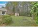This private backyard features mature trees, a storage shed, and plenty of room to play at 158 Commons Way, Goose Creek, SC 29445
