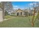Home exterior shot from yard featuring mature trees and a shed in backyard at 158 Commons Way, Goose Creek, SC 29445