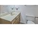 Neutral-toned bathroom features a single vanity with storage, a toilet, and a well-lit mirror at 158 Commons Way, Goose Creek, SC 29445