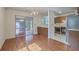 Bright dining area adjacent to kitchen boasts a stylish chandelier and sliding door at 158 Commons Way, Goose Creek, SC 29445