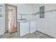 This laundry room includes a washer and dryer and shelving to make organization easy at 158 Commons Way, Goose Creek, SC 29445