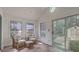 Sunroom featuring wicker furniture, large windows, and a sliding glass door to yard at 158 Commons Way, Goose Creek, SC 29445