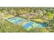 Aerial view of community tennis courts with lush surroundings, encouraging an active lifestyle and outdoor enjoyment at 158 Commons Way, Goose Creek, SC 29445