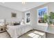 Bright bedroom with plush carpet, two large windows offering natural light, and neutral decor for a serene ambiance at 159 Cantona Dr, Summerville, SC 29483