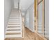 Inviting foyer with hardwood floors, staircase and a stylish front door that leads to the upper level at 159 Cantona Dr, Summerville, SC 29483