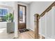 Charming entryway with hardwood floors, view of adjacent living room, and a door with a keypad entry at 159 Cantona Dr, Summerville, SC 29483