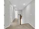 Well-lit upstairs hallway with carpet and wood banister, leading to bedrooms and other living spaces at 159 Cantona Dr, Summerville, SC 29483
