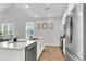 Bright kitchen featuring stainless steel appliances, quartz countertops, and modern cabinetry at 159 Cantona Dr, Summerville, SC 29483