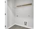 Functional laundry room featuring tile flooring, shelving, and readily accessible washer and dryer hookups at 159 Cantona Dr, Summerville, SC 29483