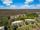Beautiful aerial view of the building that showcases nearby tennis courts and surrounding marsh views at 1638 Live Oak Park, Seabrook Island, SC 29455