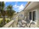 Cozy balcony with seating offering views of palm trees and adorned with turtle decor at 1638 Live Oak Park, Seabrook Island, SC 29455