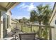 Relaxing balcony view overlooking lush greenery, a tennis court and beautiful palm trees at 1638 Live Oak Park, Seabrook Island, SC 29455