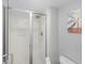 Bright bathroom featuring a modern shower with a glass door and a Heron themed print on the wall at 1638 Live Oak Park, Seabrook Island, SC 29455