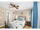 Comfortable bedroom with balcony access, tropical bedding and ensuite bathroom at 1638 Live Oak Park Park, Seabrook Island, SC 29455