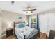 Inviting bedroom with ceiling fan, balcony and tropical bedding at 1638 Live Oak Park, Seabrook Island, SC 29455