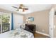 Bright bedroom with balcony access, dresser, and tropical bedding at 1638 Live Oak Park, Seabrook Island, SC 29455