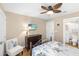 Bedroom with balcony access, dresser, ensuite bathroom and tropical bedding at 1638 Live Oak Park, Seabrook Island, SC 29455