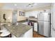 Updated kitchen featuring granite countertops, stainless appliances, and ample storage space at 1638 Live Oak Park, Seabrook Island, SC 29455