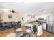 Open kitchen featuring granite countertops, stainless steel appliances, and breakfast bar seating at 1638 Live Oak Park, Seabrook Island, SC 29455