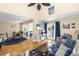 Bright living room with vaulted ceilings, hardwood floors, and beach-themed decor at 1638 Live Oak Park, Seabrook Island, SC 29455