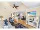 Cozy living room with hardwood floors, beach-themed rug, and comfortable seating area at 1638 Live Oak Park, Seabrook Island, SC 29455