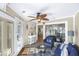 Charming sunroom features a wicker seating area and tiled floors at 1638 Live Oak Park, Seabrook Island, SC 29455