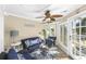 Bright sunroom with comfortable seating, ceiling fan, and plenty of natural light at 1638 Live Oak Park, Seabrook Island, SC 29455
