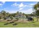 Serene tennis courts and clubhouse surrounded by palm trees creating a resort-like atmosphere at 1638 Live Oak Park, Seabrook Island, SC 29455