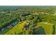 An aerial view showcases the property's verdant acreage surrounded by lush trees at 1657 Short Cut Rd, Cross, SC 29436