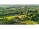 An aerial view showcases the property's verdant acreage surrounded by lush trees at 1657 Short Cut Rd, Cross, SC 29436