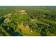 Expansive aerial view of the land with mature trees and a view of the pond at 1657 Short Cut Rd, Cross, SC 29436