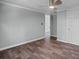 This bedroom offers neutral walls, a ceiling fan, wood-look floors, and a conveniently located doorway at 1657 Short Cut Rd, Cross, SC 29436