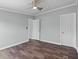Inviting bedroom featuring wood floors, neutral paint, and a ceiling fan for added comfort at 1657 Short Cut Rd, Cross, SC 29436