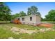 Exterior view of this charming home featuring a small wood porch and a well-manicured lawn at 1657 Short Cut Rd, Cross, SC 29436