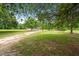 Expansive yard with a home nestled among mature trees at 1657 Short Cut Rd, Cross, SC 29436