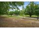 Large, tree-filled yard with a home visible in the distance at 1657 Short Cut Rd, Cross, SC 29436