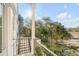 Balcony view featuring lush trees and a body of water in the distance at 172 Mary Ellen Dr, Charleston, SC 29403