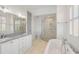 Luxurious bathroom featuring a double vanity, walk-in shower, and freestanding tub at 172 Mary Ellen Dr, Charleston, SC 29403