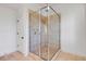 This bathroom showcases a glass-enclosed shower with neutral tile and modern fixtures, and door to the outside at 172 Mary Ellen Dr, Charleston, SC 29403