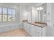 Bright bathroom features double vanity, granite countertops, and storage under a large window with shutters at 172 Mary Ellen Dr, Charleston, SC 29403