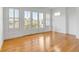 Light-filled bedroom with hardwood floors and large French doors leading to a balcony at 172 Mary Ellen Dr, Charleston, SC 29403