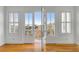 Bright bedroom with French doors opening to a balcony and serene outdoor views at 172 Mary Ellen Dr, Charleston, SC 29403