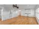 Bright bonus room offers hardwood floors, bar sink, unique ceiling fan, and access to multiple rooms at 172 Mary Ellen Dr, Charleston, SC 29403
