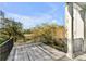 Wooden deck with black metal railing overlooking trees and a body of water at 172 Mary Ellen Dr, Charleston, SC 29403