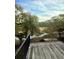 Scenic backyard view from a wooden deck with black metal railing overlooking tranquil marshland at 172 Mary Ellen Dr, Charleston, SC 29403