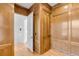 Wood paneled hallway with a light-colored hardwood floor and an open doorway to another room at 172 Mary Ellen Dr, Charleston, SC 29403