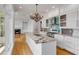 Open kitchen with island, stainless appliances, and view to the living room at 172 Mary Ellen Dr, Charleston, SC 29403