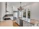 Kitchen with white cabinets, stainless appliances, island, and adjacent balcony at 172 Mary Ellen Dr, Charleston, SC 29403